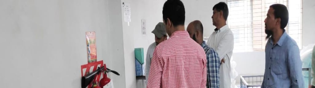 People reading instructions on a wall